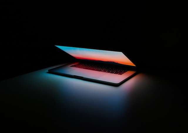 Digital professional working securely on laptop with privacy protection enabled