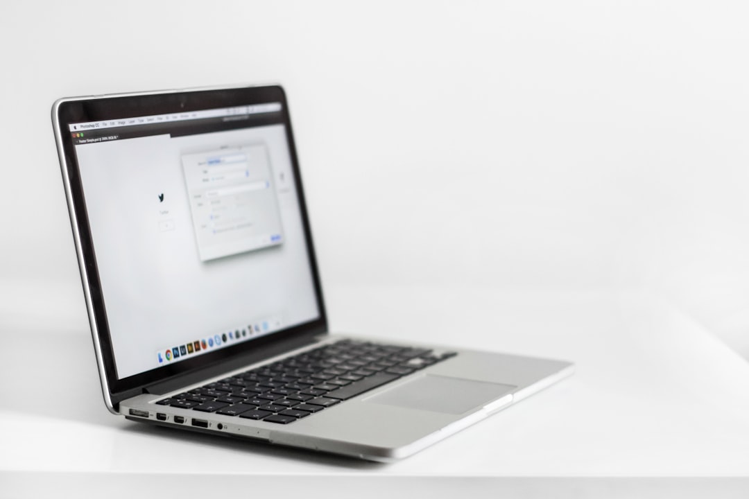 Person using laptop with multiple browser tabs for online privacy and account isolation
